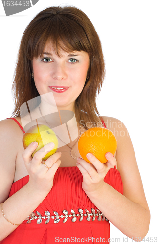 Image of girl with orange and apple in hands