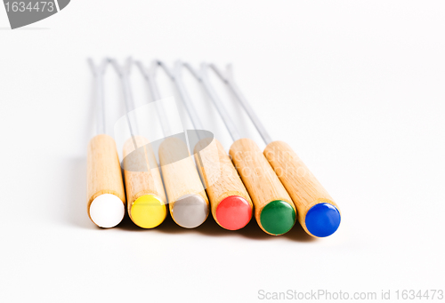 Image of colored fondue forks