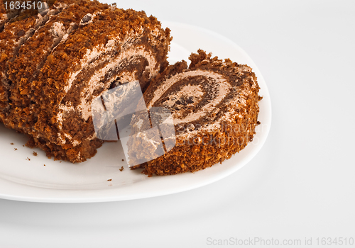 Image of sliced chocolate roll on white dish