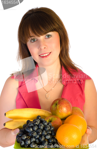 Image of beautiful smiling girl with dish of fruits