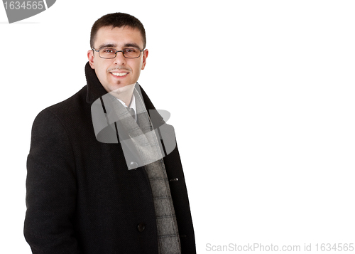 Image of smiling businessman in autumn coat