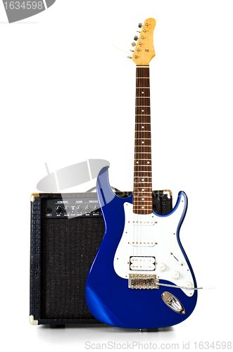 Image of electric guitar stand in front of amplifier