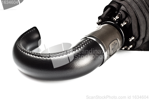 Image of black umbrella handle closeup