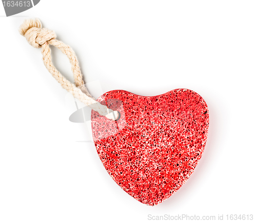 Image of red heart-shaped stone with rope