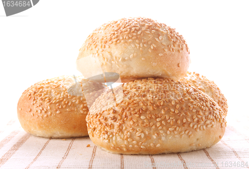 Image of four buns with sesame seeds