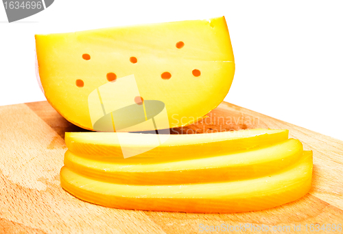 Image of cheese slices on cutting board