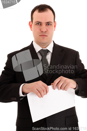 Image of businessman ready tear paper