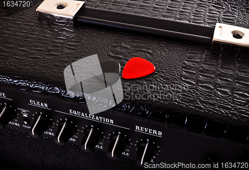 Image of two plectrums on guitar amplifier