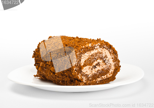 Image of chocolate roll on white dish