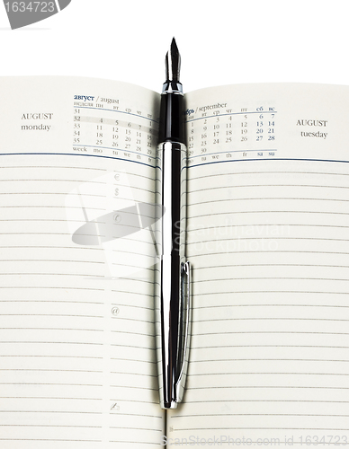 Image of fountain pen on diary