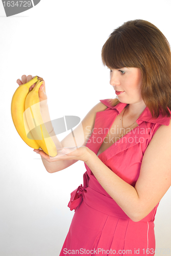 Image of beautiful girl with bananas in hand