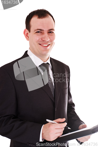 Image of smiling businessman with pen and notepad