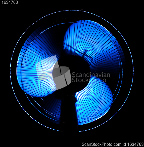 Image of big office fan in blue light