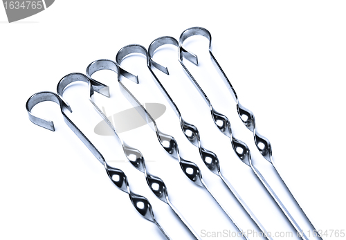 Image of metal skewers set closeup