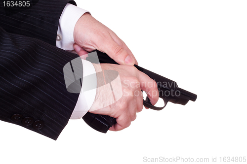 Image of hands reload pistol