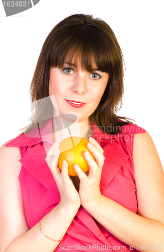 Image of beautiful girl with orange in hands