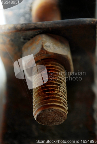 Image of rusty screw and nut closeup