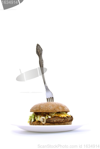 Image of fork stuck in a fat sandwich