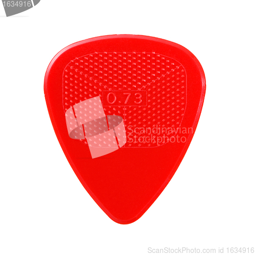 Image of red ribbed guitar plectrum isolated on white