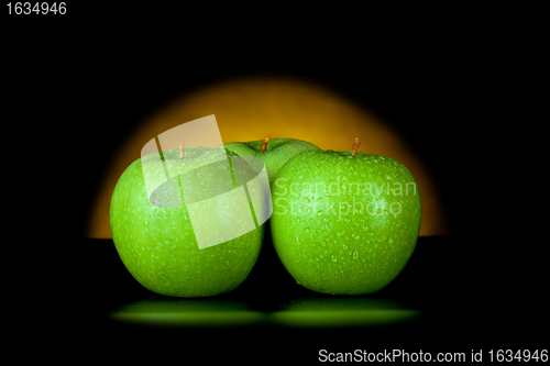 Image of green apples in yellow light