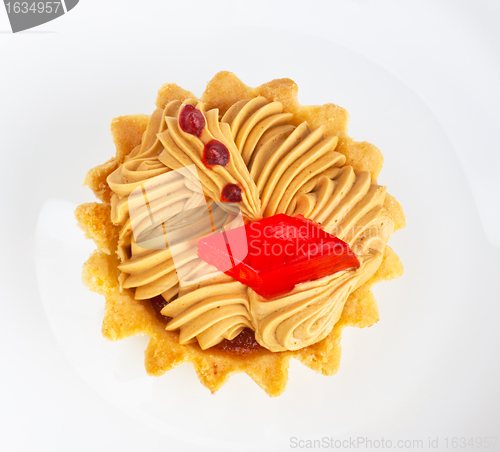 Image of cake with fruit jelly on white dish