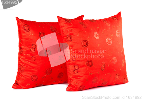 Image of two red decorative pillows with pattern