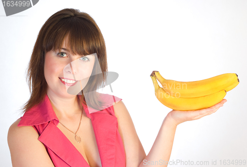 Image of beautiful girl with bananas in hand 