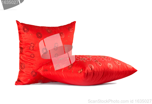 Image of two red decorative pillows with pattern