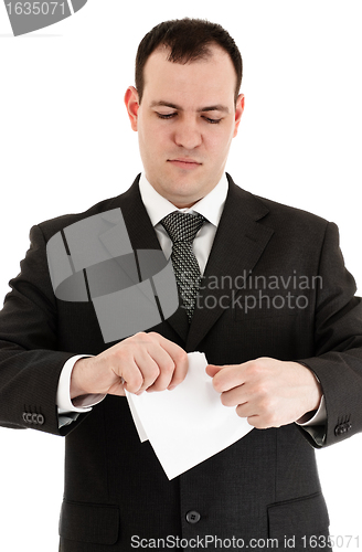 Image of businessman tear paper