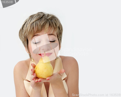 Image of Funny girl with a pear