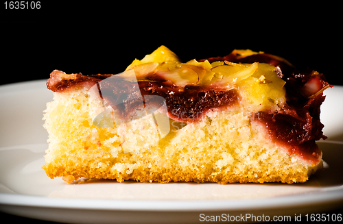 Image of berry pie with nuts on white dish