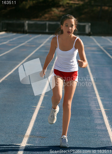 Image of Girl exercising on a blue racetrack