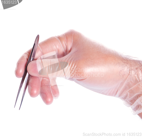 Image of hand in rubber glove holding tweezers