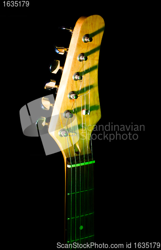 Image of guitar neck in the dark