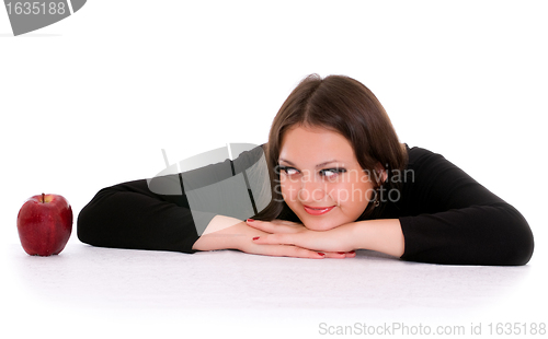 Image of girl staring at the red apple