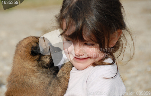 Image of little girl and puppy