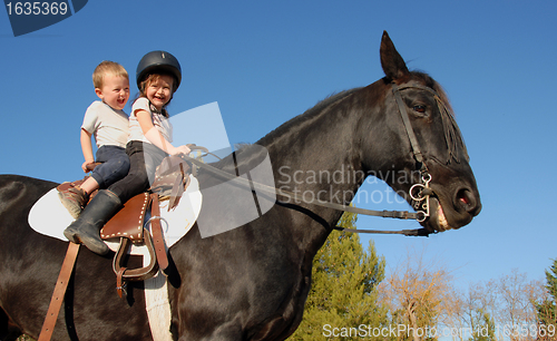 Image of children on stallion