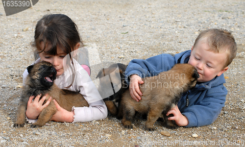 Image of children and puppies