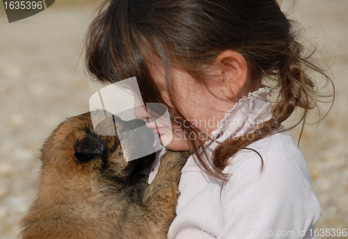 Image of sad girl and puppy