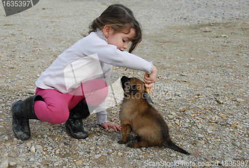 Image of little girl and puppy