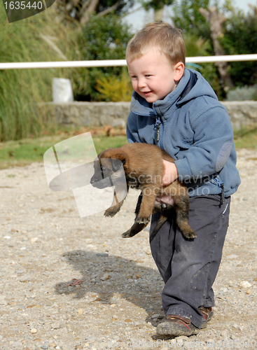 Image of little boy and puppy