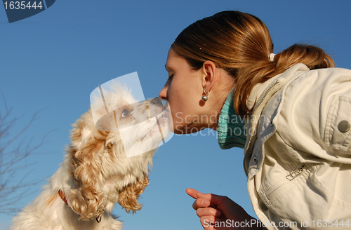 Image of kissing woman and dog