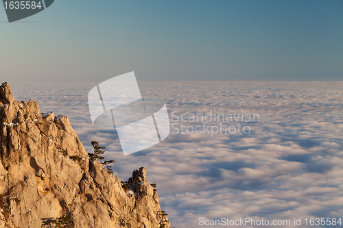 Image of Evening rocks and sea in clouds