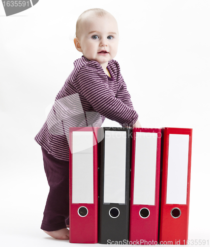 Image of young child with ring file