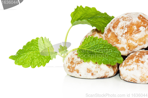Image of gingerbread and Peppermint leaves, isolated on white