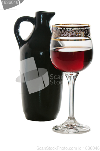 Image of Black jug for wine and a glass of red wine 