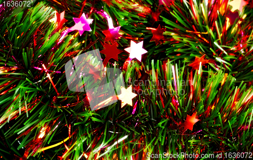 Image of christmas tinsel with stars