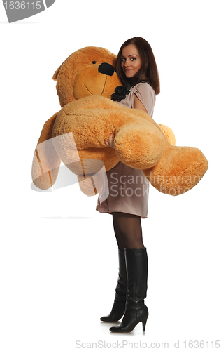 Image of beautiful girl with toy bear