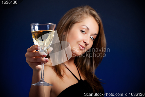 Image of beautiful girl with glass of wine