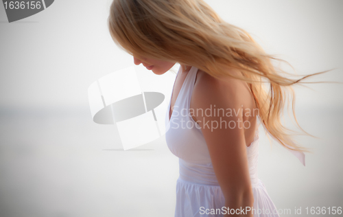 Image of beautiful girl on seashore